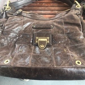 Lightly used brown leather Juicy Couture purse